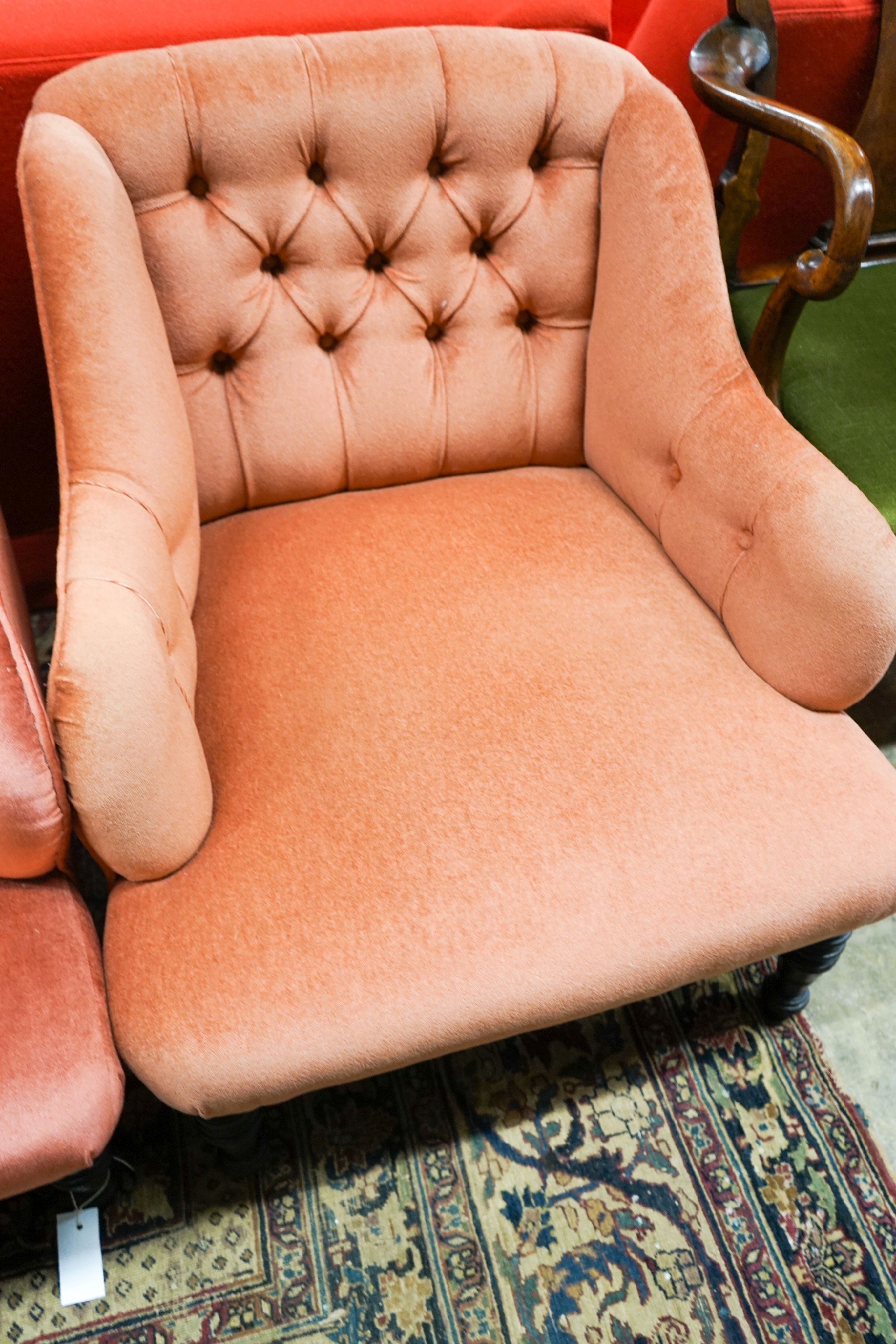 A late Victorian three piece lounge suite, upholstered in pink dralon, settee length 140cm, depth 80cm, height 78cm